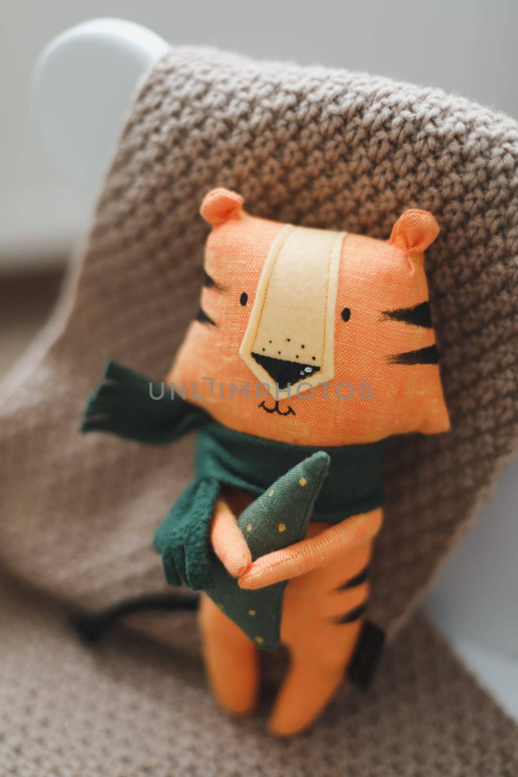 Christmas composition with a tiger toy, symbol of new 2022, a gift and decorations. Christmas, winter, New year concept