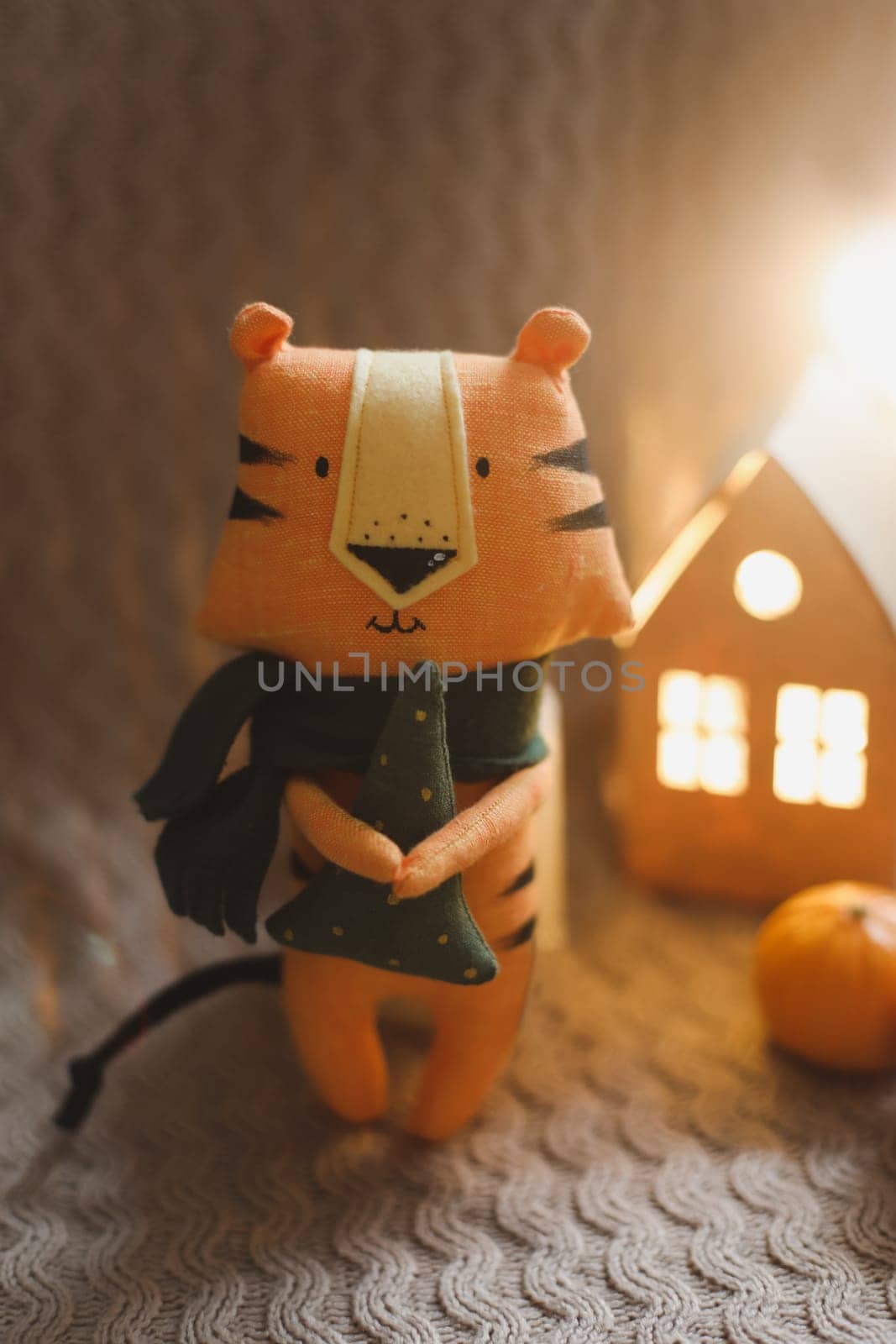 Christmas composition with a tiger toy, symbol of new 2022, a gift and decorations. Christmas, winter, New year concept