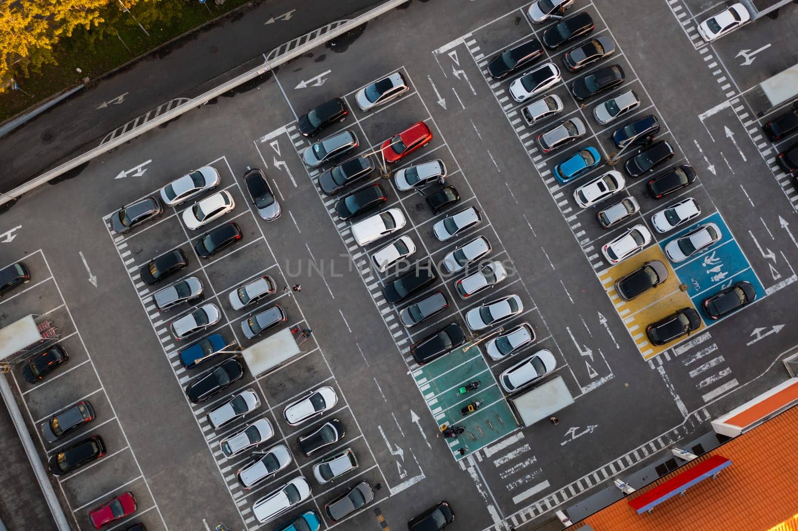 Car parking near shopping mall aerial view by andreonegin