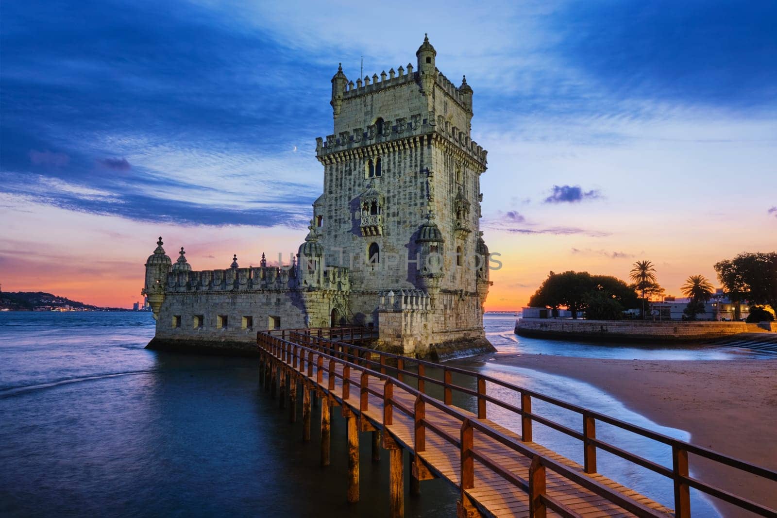 Belem Tower on the bank of the Tagus River in dusk after sunset. Lisbon, Portugal by dimol
