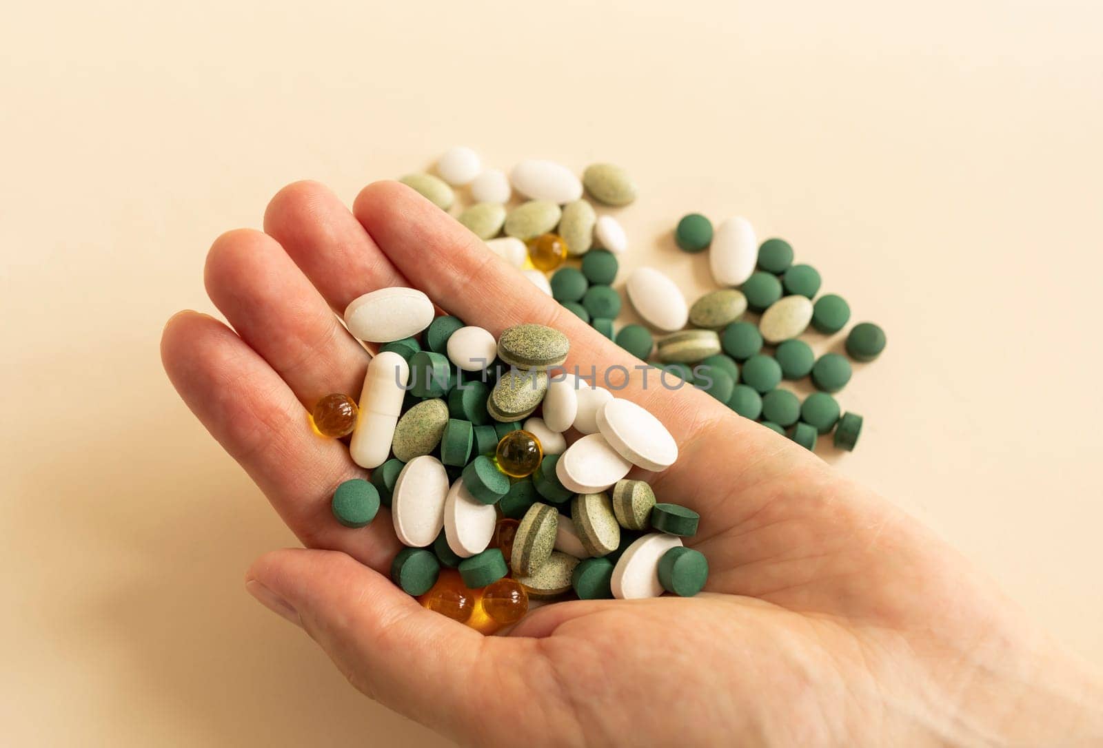 Sick, Asian 40s woman, female hand holding capsule pill, painkiller medicine from headache, stomach pain, Health Treatment, Taking drug or vitamin, pharmacy and health care. Horizontal Plane