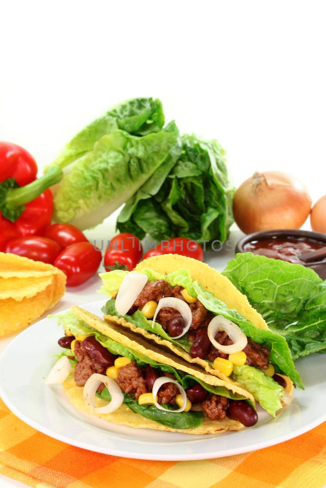 Taco shells stuffed with ground beef,kidney beans and corn