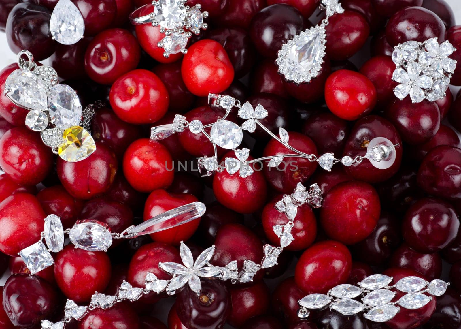 Jewels at fruit red ripe cherries berry background