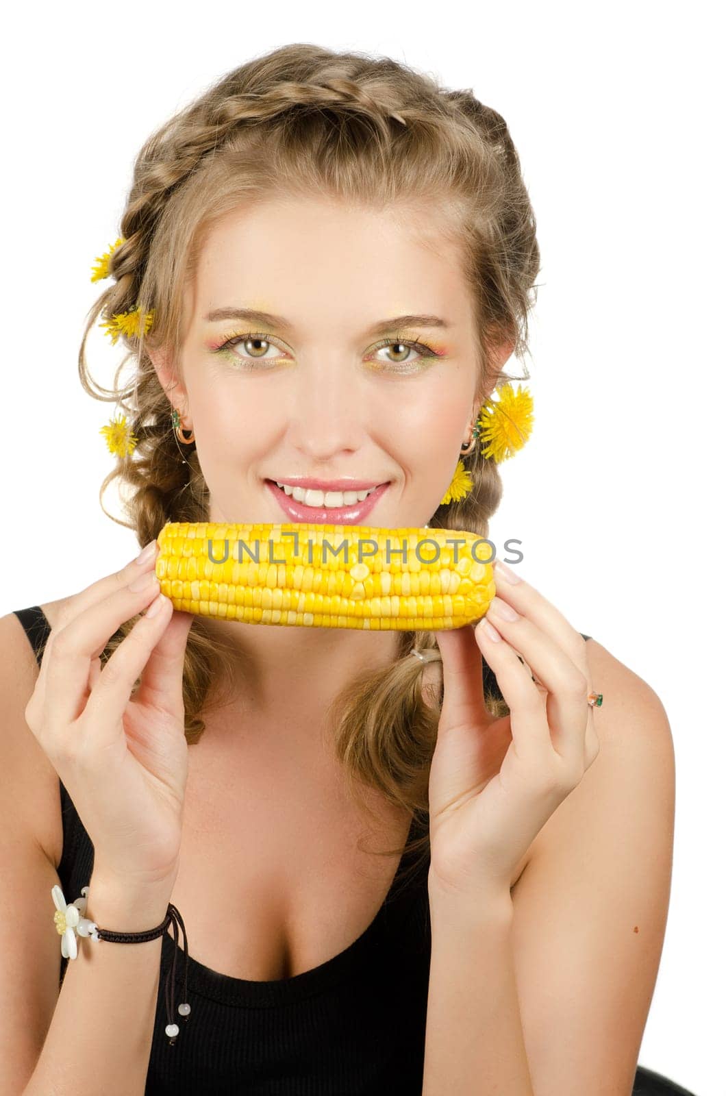 Close-up portrait of young beauty woman eating corn-cob on a white