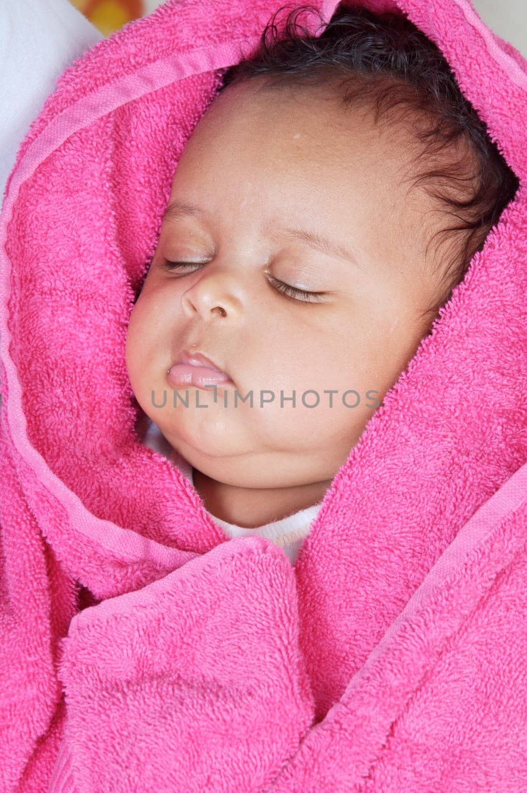 adorable sleepy girl a over pink background