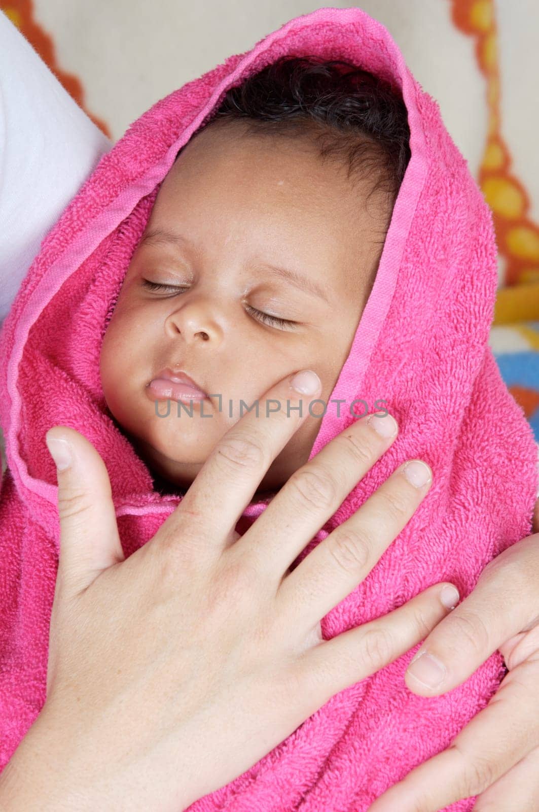 adorable sleepy girl a over pink background