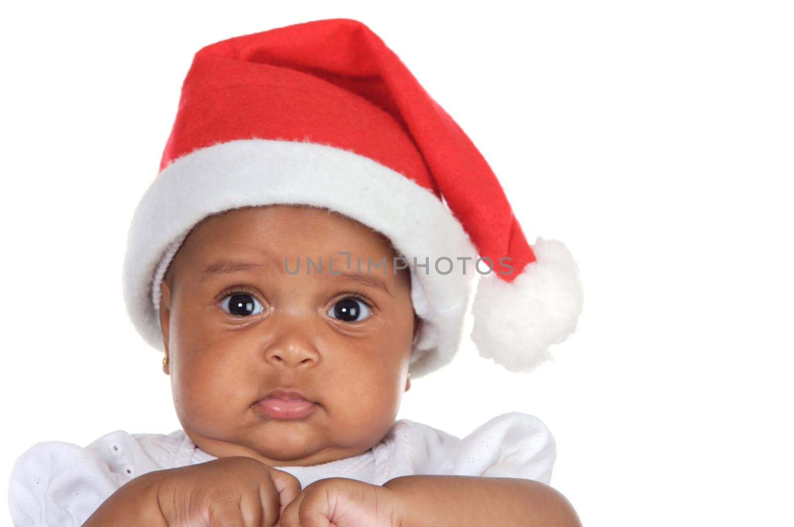Adorable baby girl with santa hat over white background