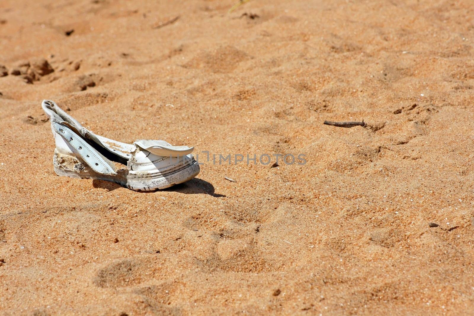 A washed up shoe on the beach in Sri Lanka
