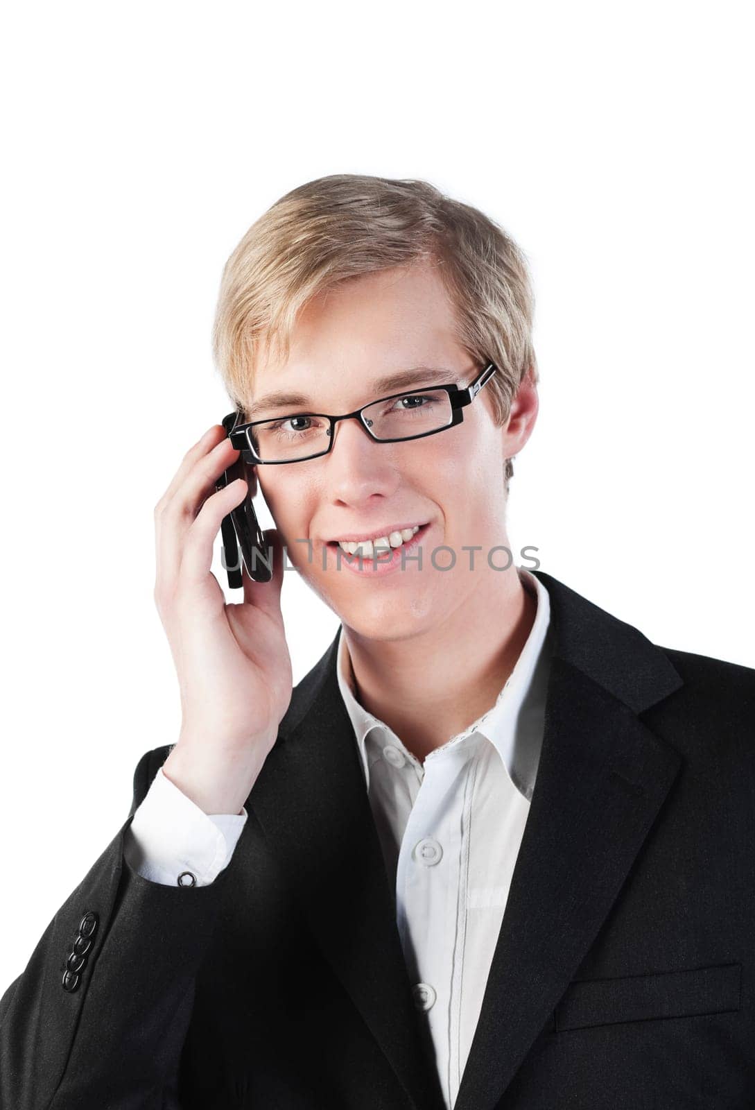 Young handsome smiling man in glasses speaking on cellphone