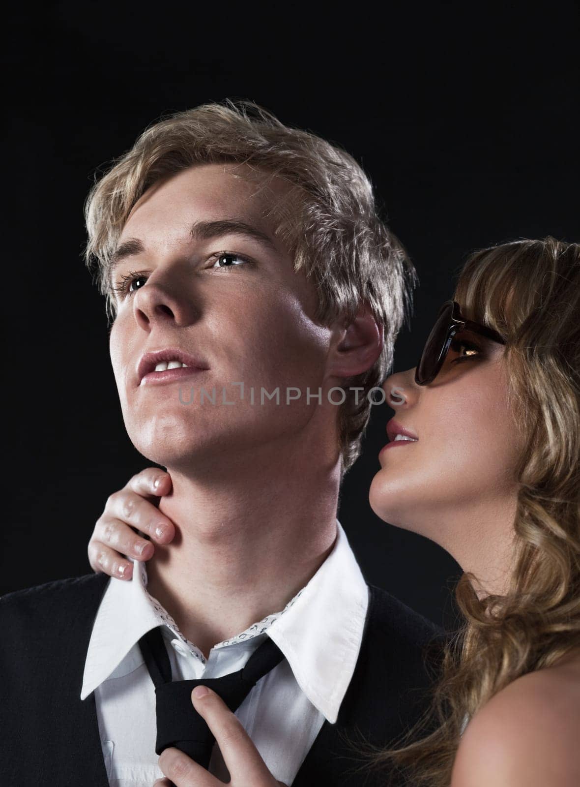 Young blond handsome man and pretty blond woman in sunglasses