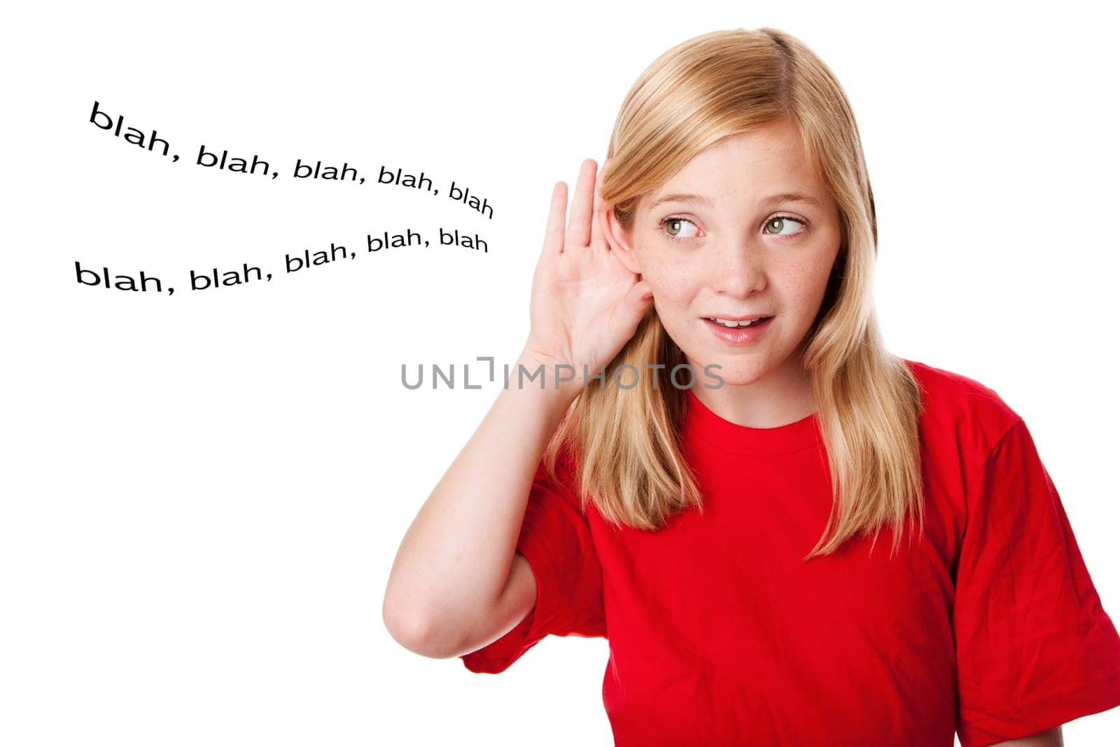 Beautiful cute blond teenage girl with hand directing ear listening hearing words. Concept what kids hear. Isolated.