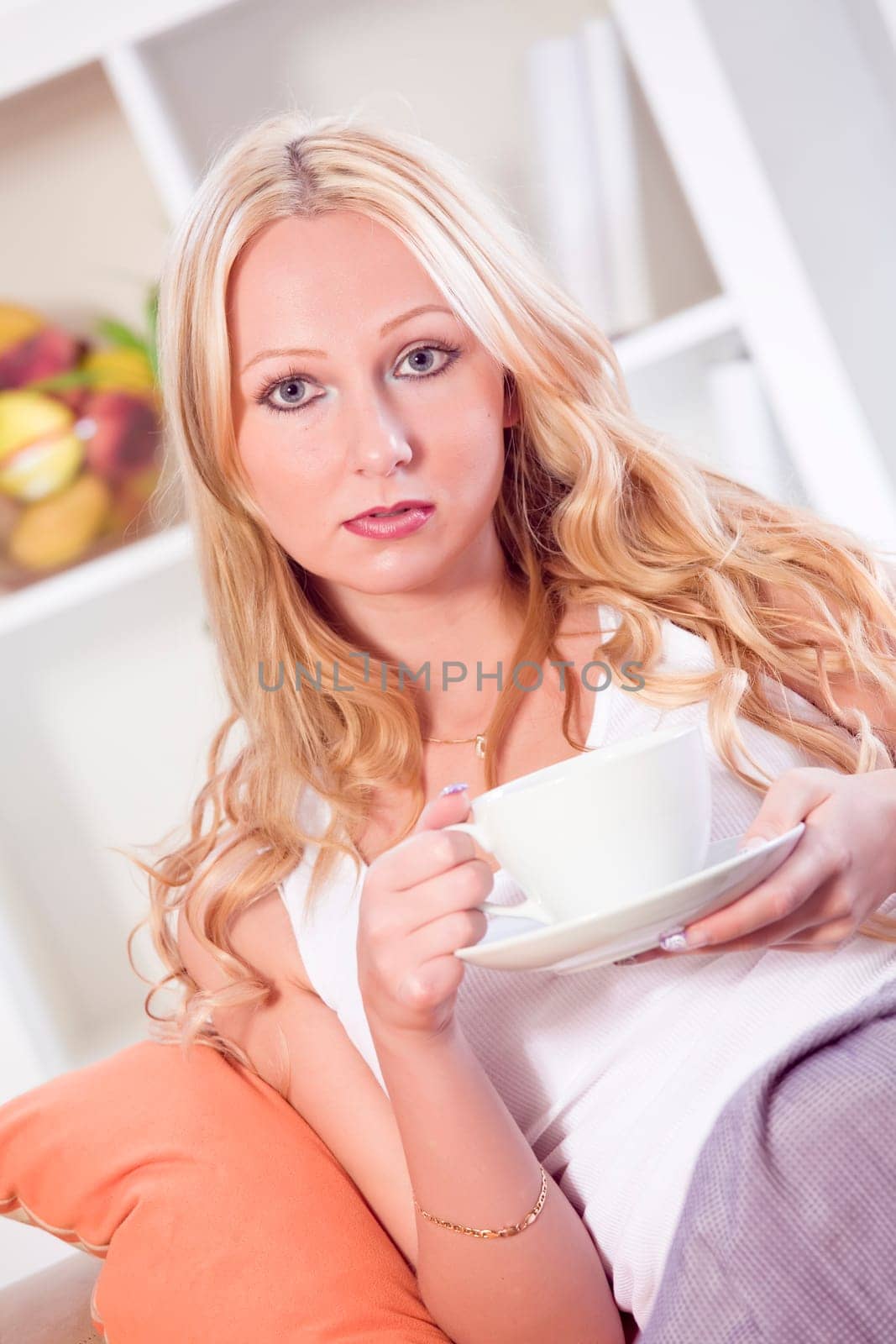 woman holding a cup tea or coffee at home