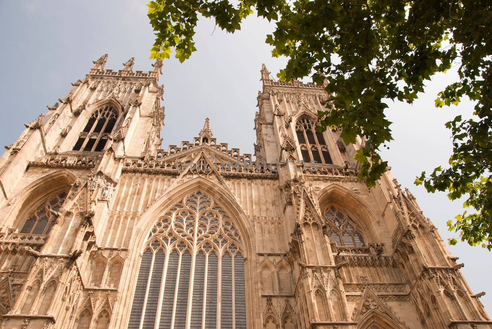 A View of the West Entrance of York Minster Yorkshire England under a blue sky