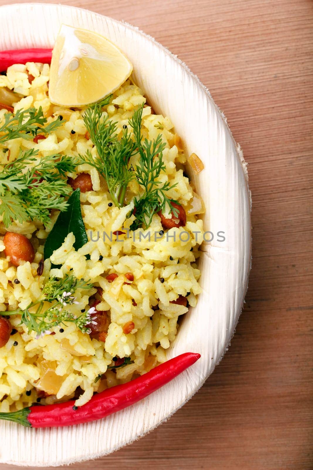 Indian rice breakfast - yellow rice garnished with coriander