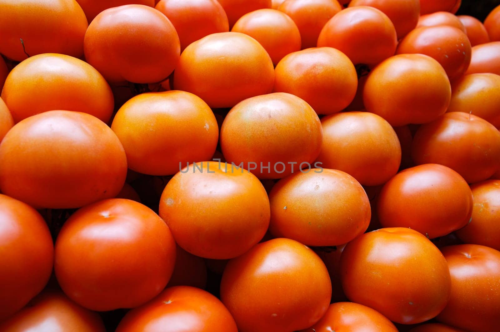 piling up of tomatoes in a store of fruits