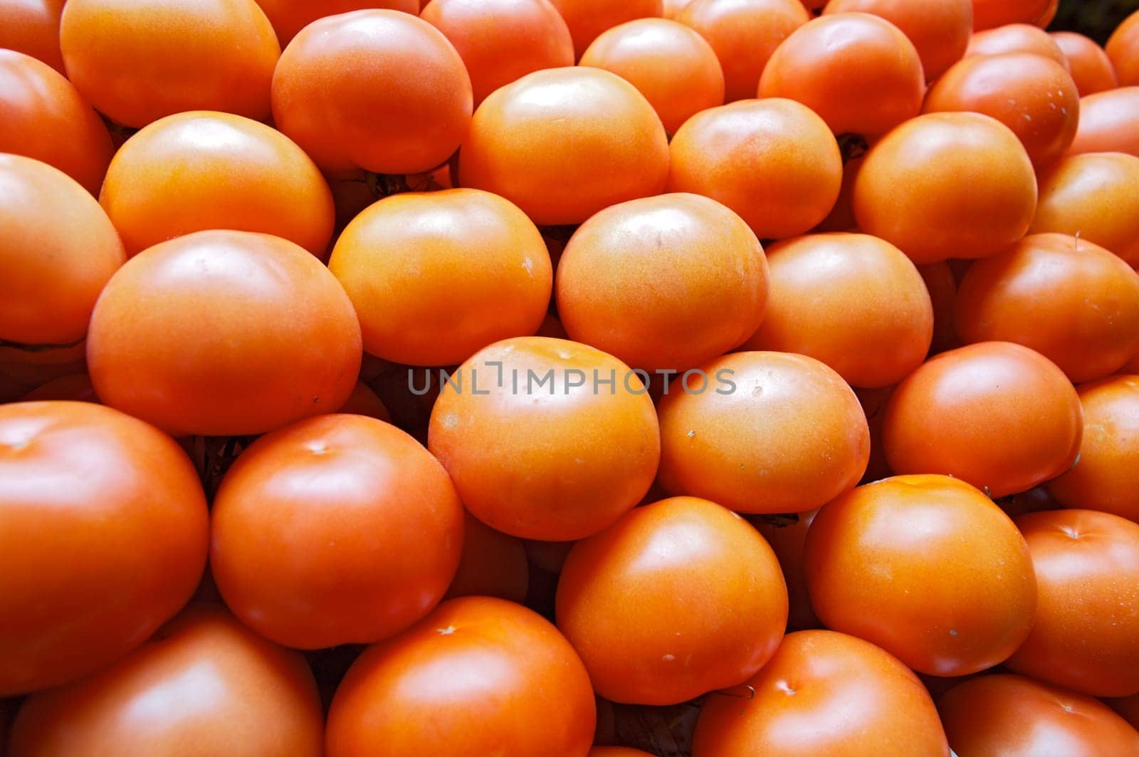 piling up of tomatoes in a store of fruits