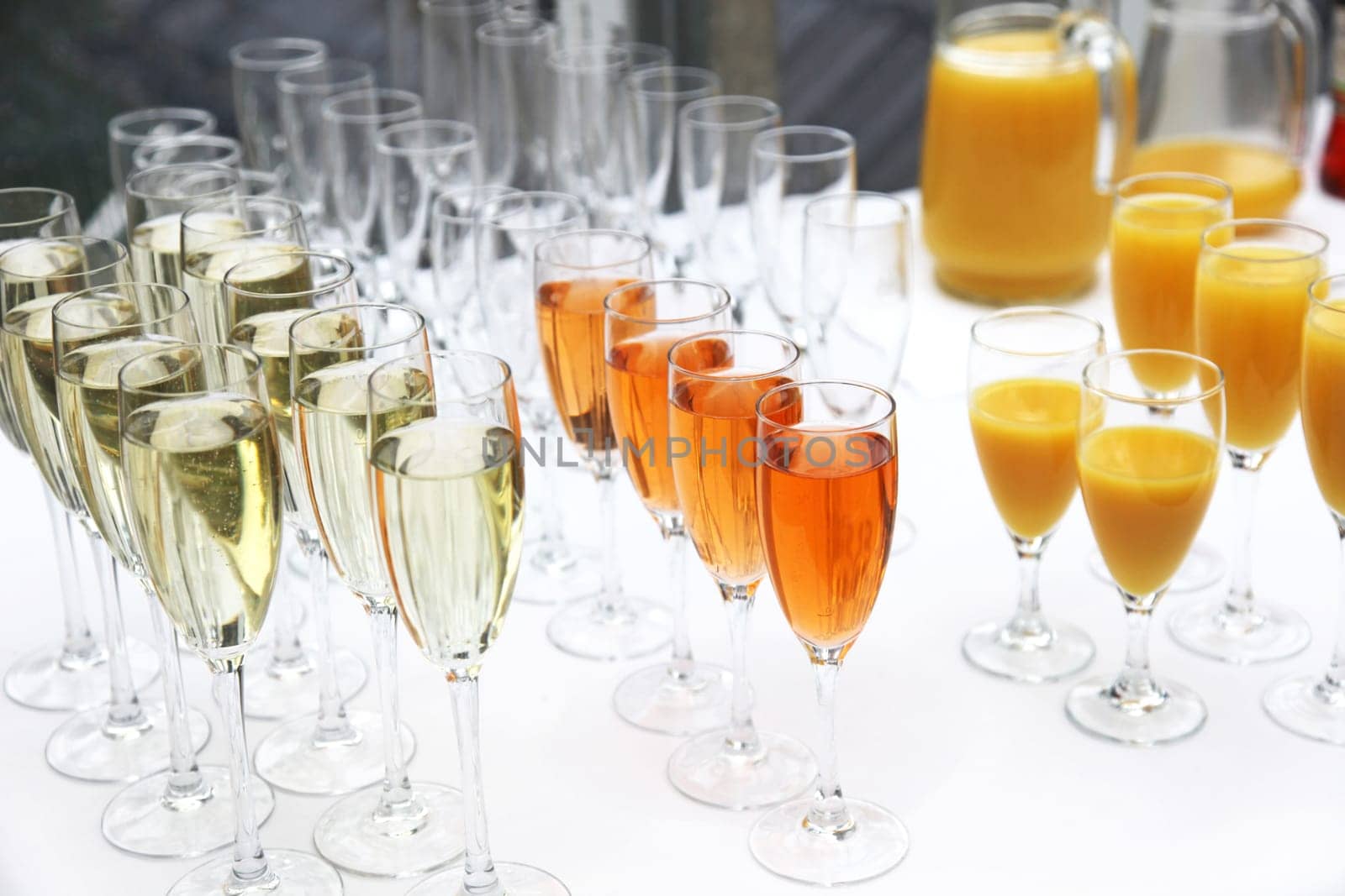 Many glasses of sparkling wine,champagne and cocktails in a row at the champagne reception