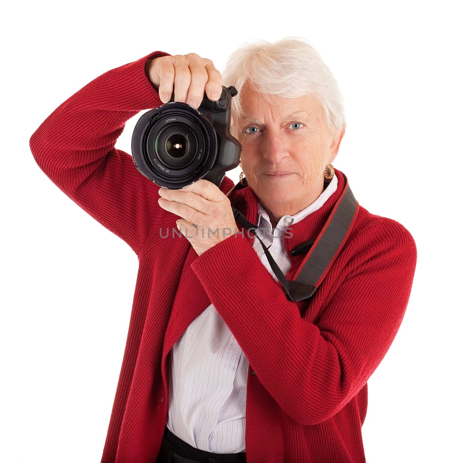 A senior woman is photographing you.