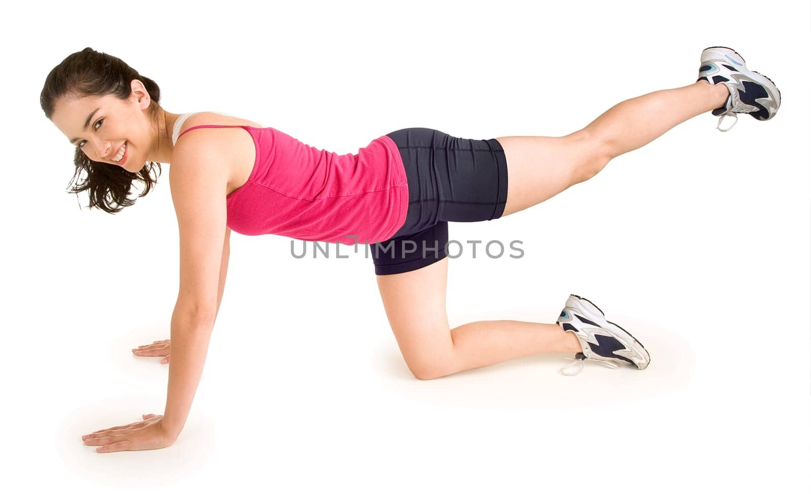 A young beautiful woman is exercising and stretching.