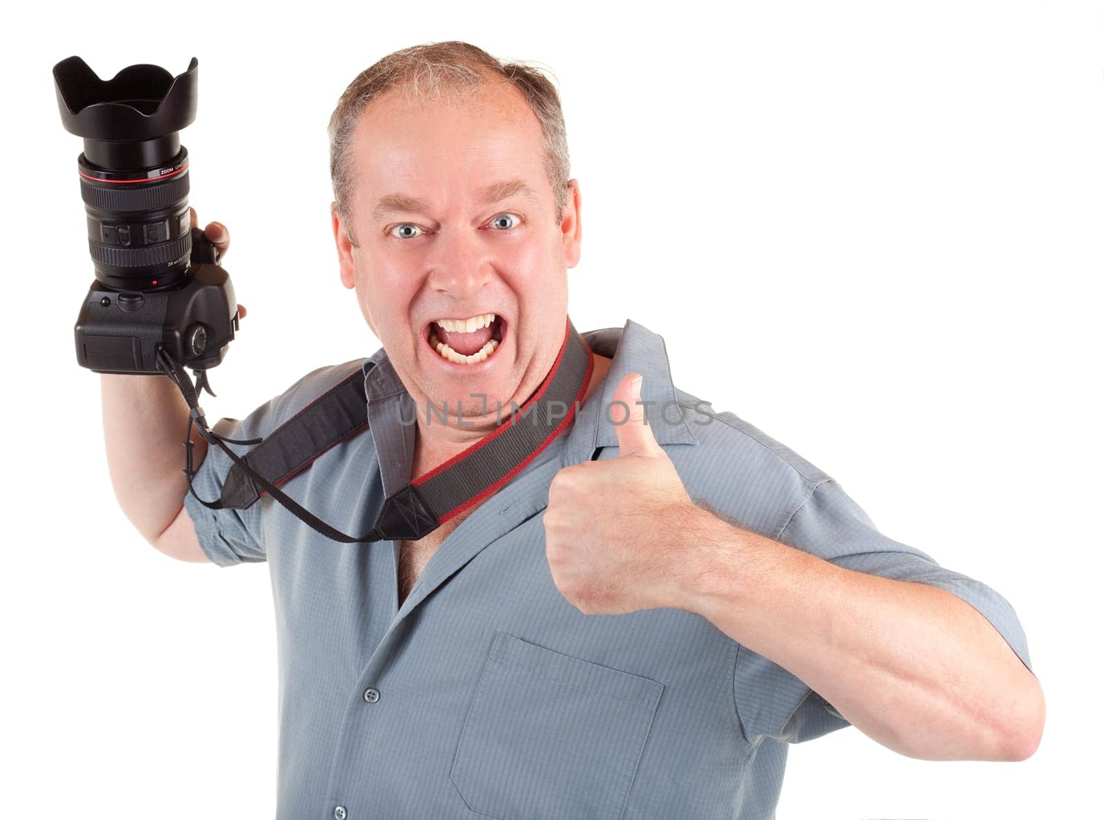 A male photographer had a successful photo shoot and showing his appreciation with his thumb up.