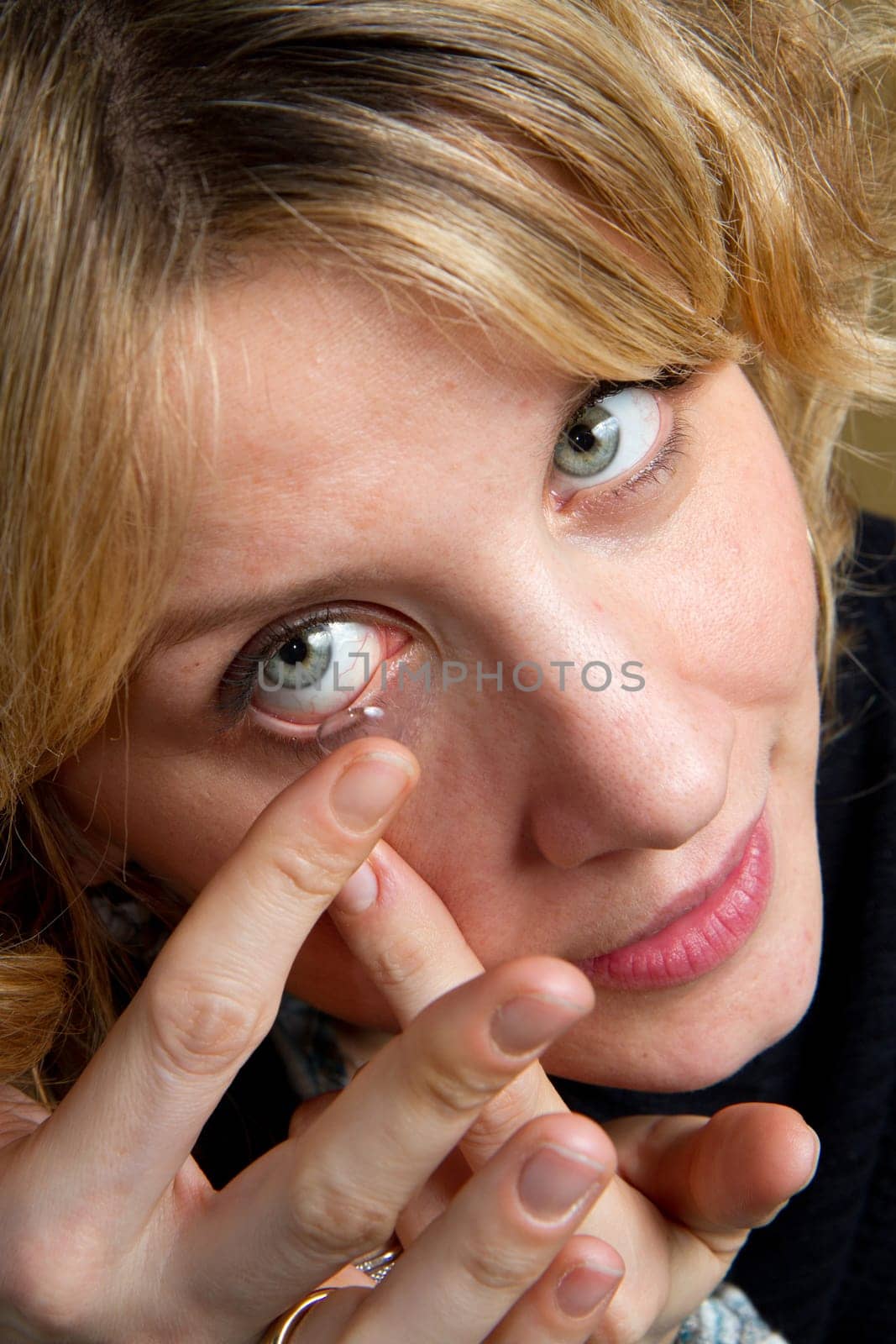 a blonde girl with contact lens