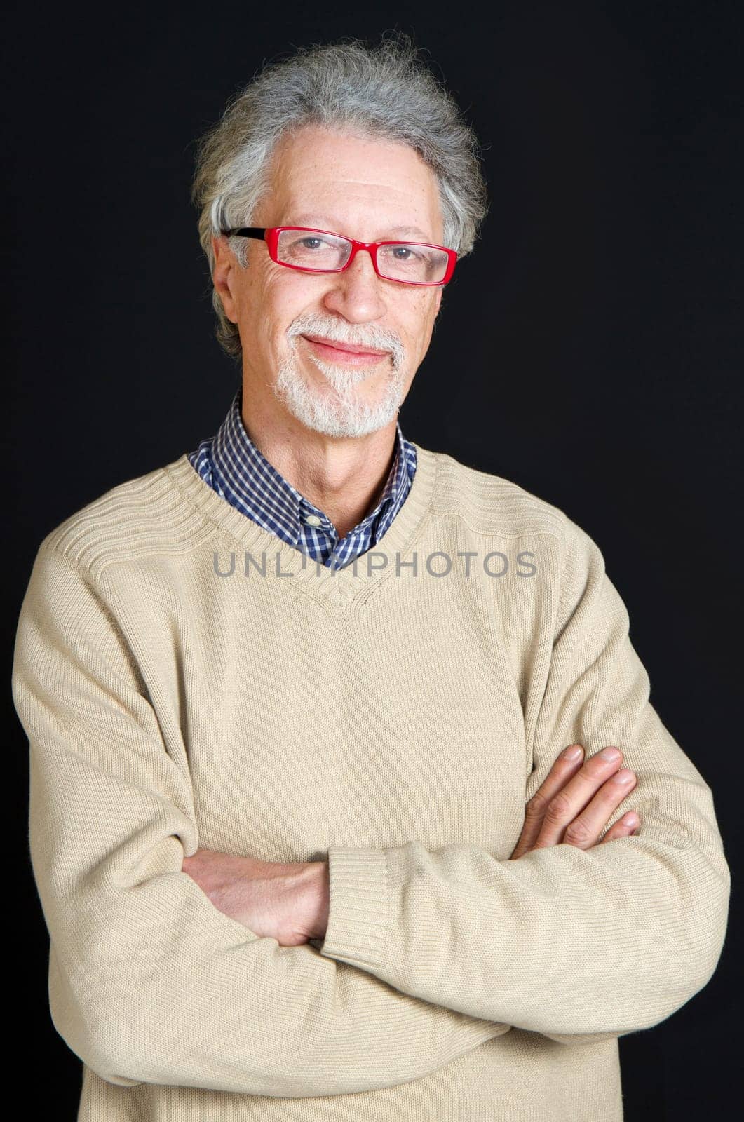 Portrait of a happy mature man isolated on black background