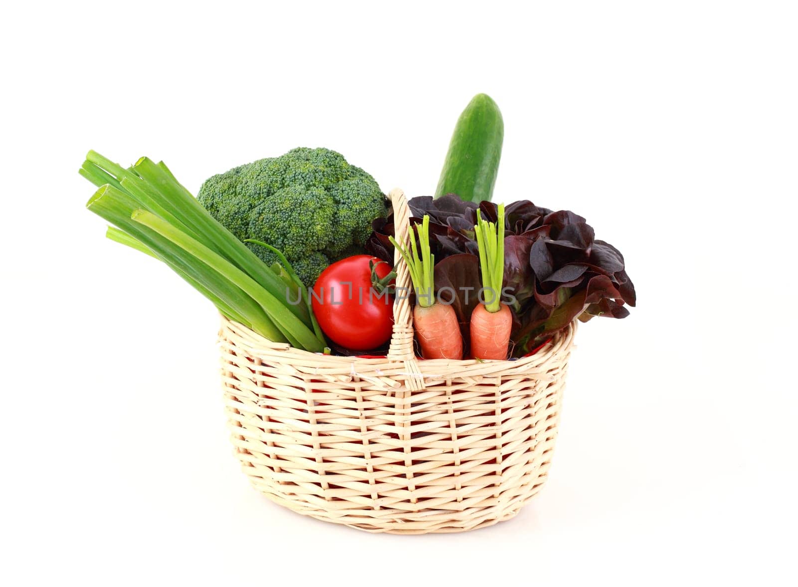 Various vegetables and fruits in the basket on white background