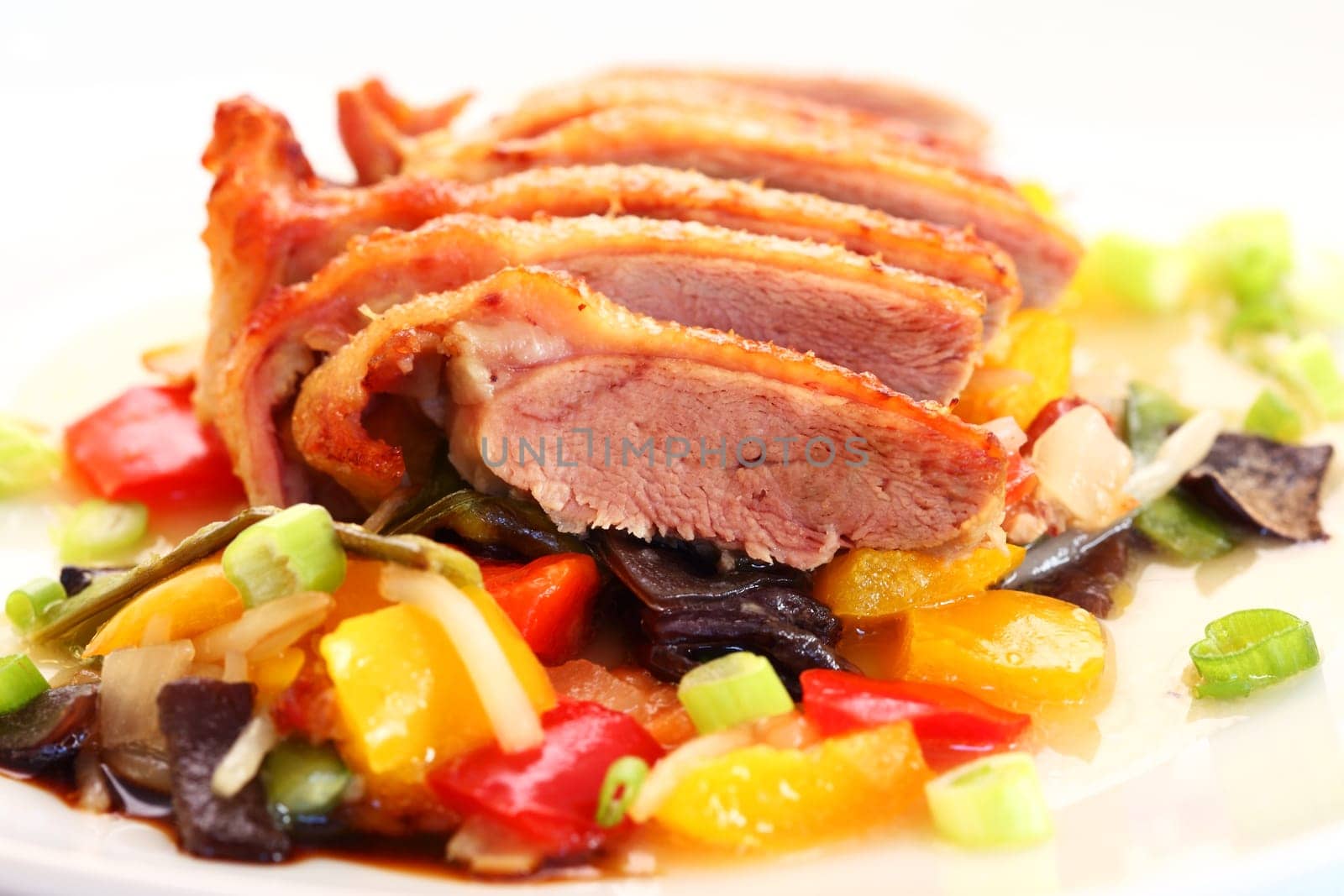 Delicious roasted duck on vegetables