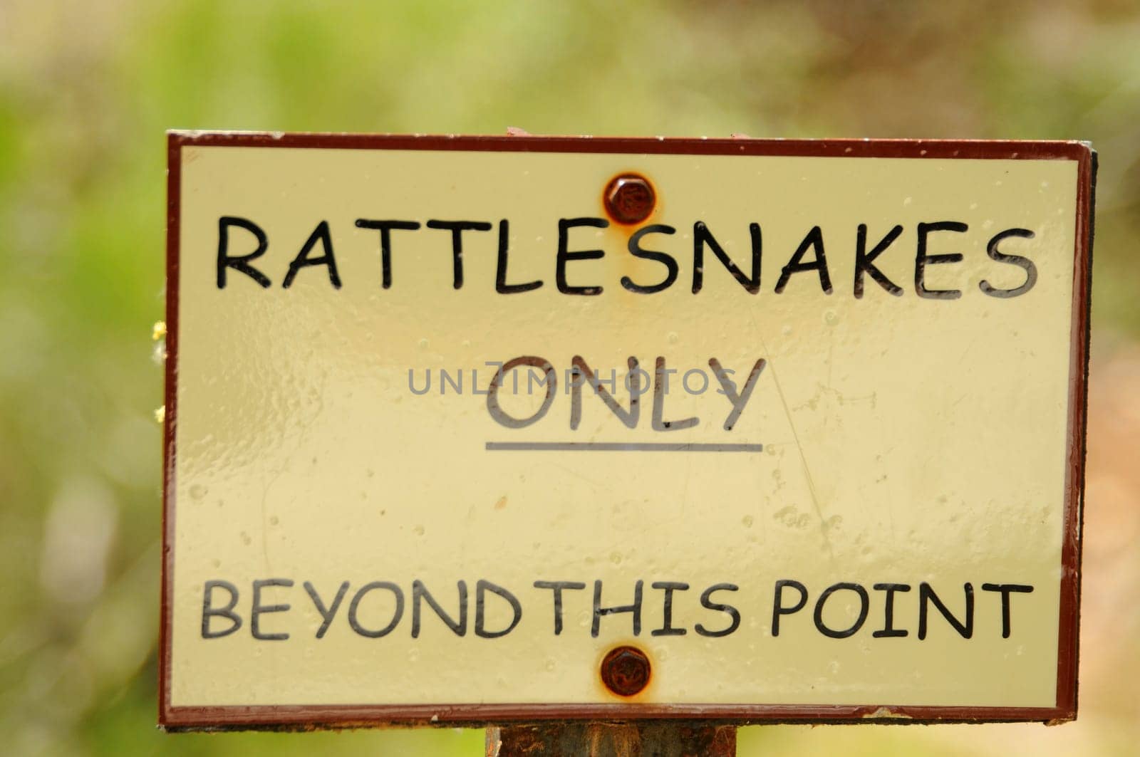 Sign for Rattlesnakes only beyond this point