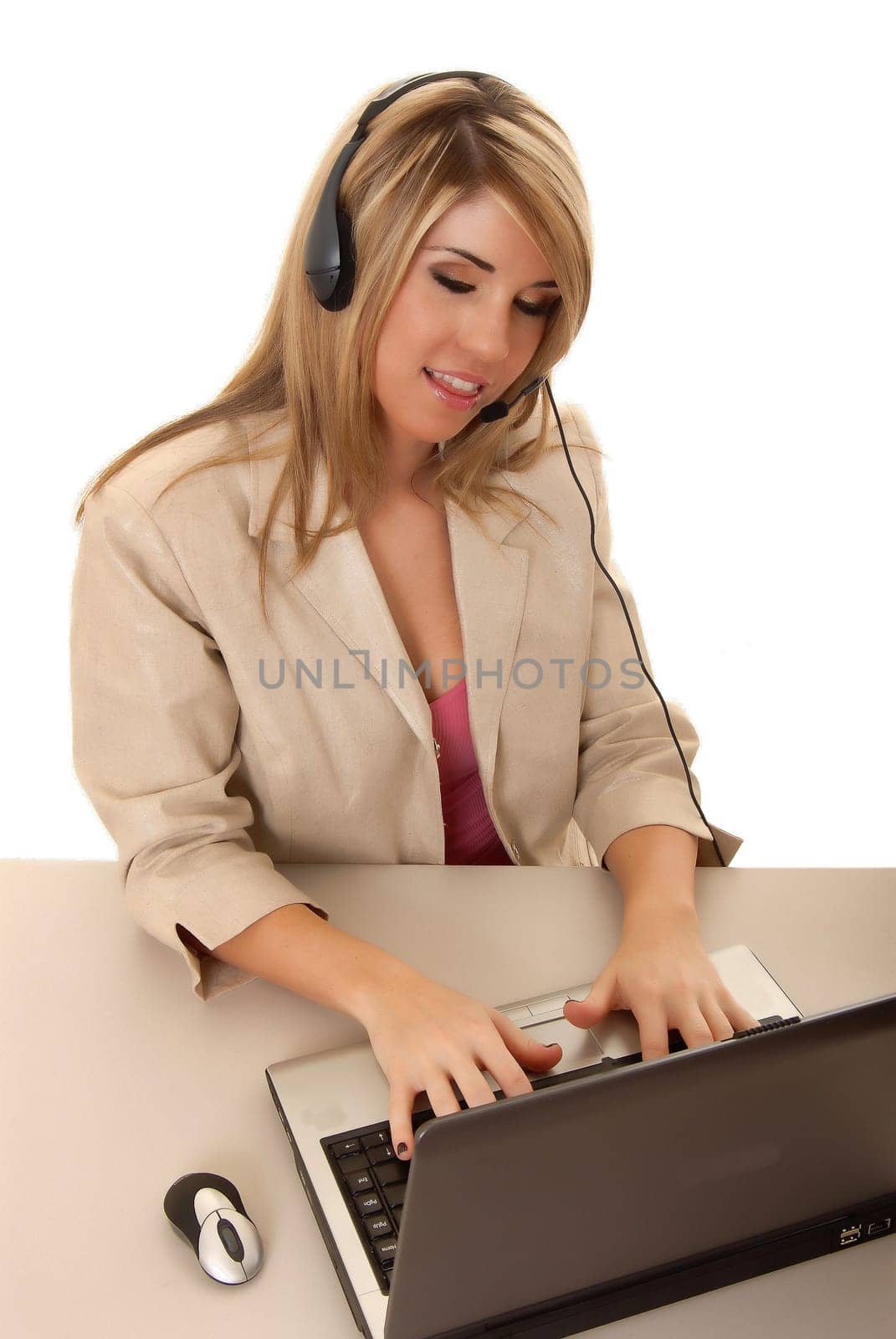 Beautiful and sexy blond business woman with laptop
