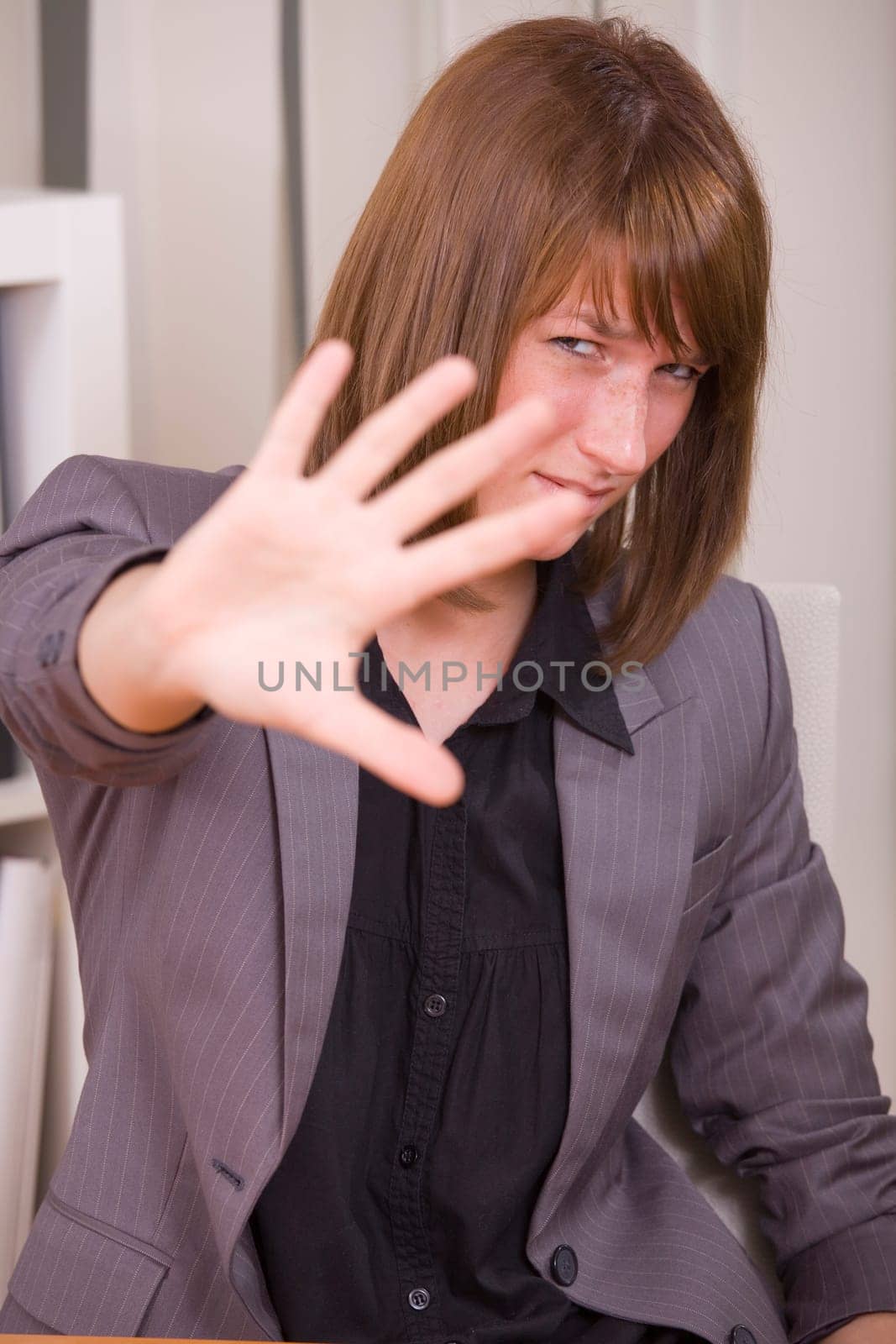 overworked business woman with stop hand sign