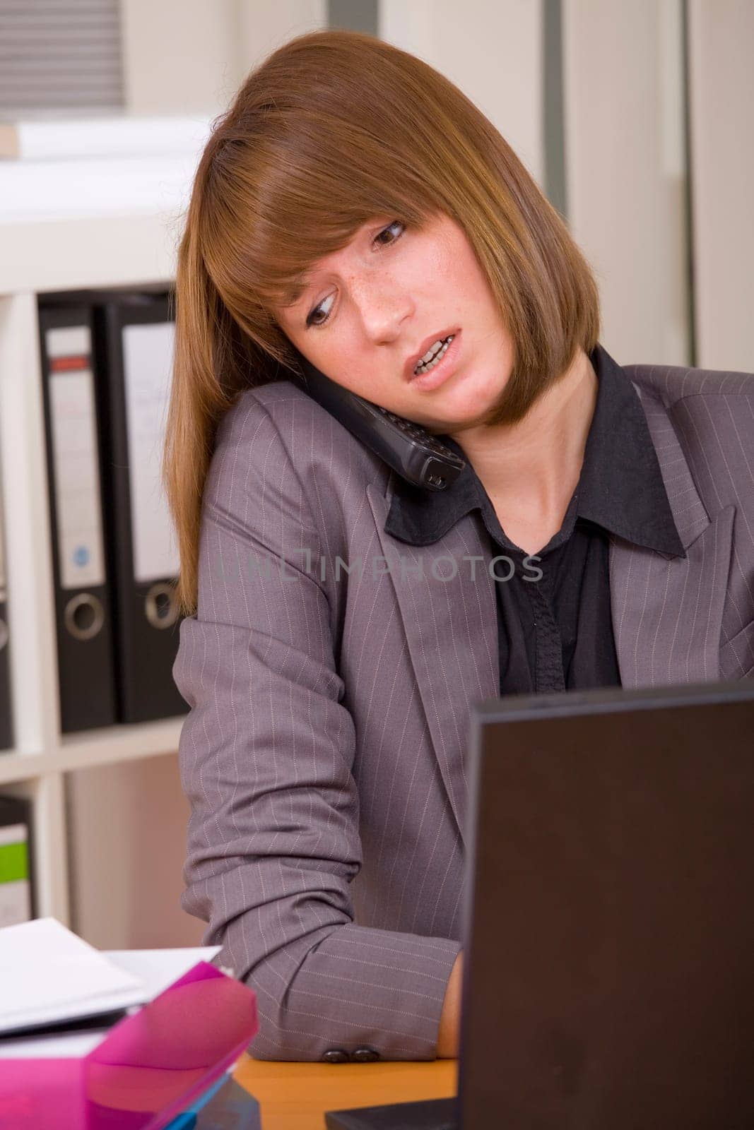female secretary in stress by office work