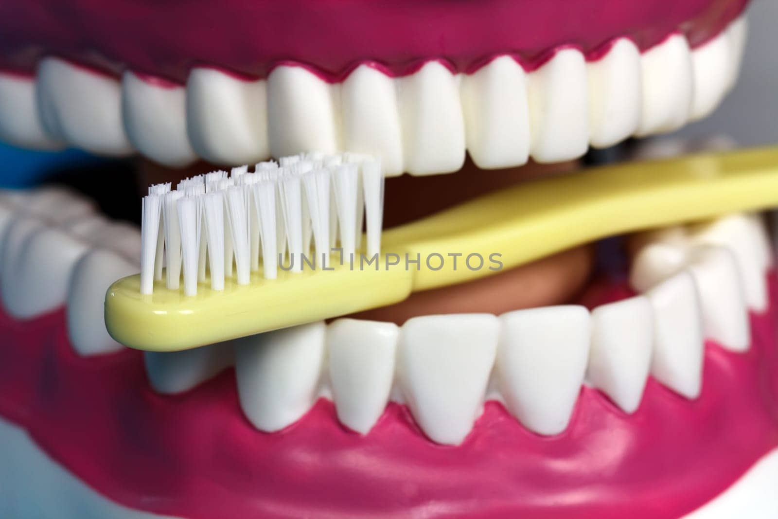 Brushing your teeth with a toothbrush