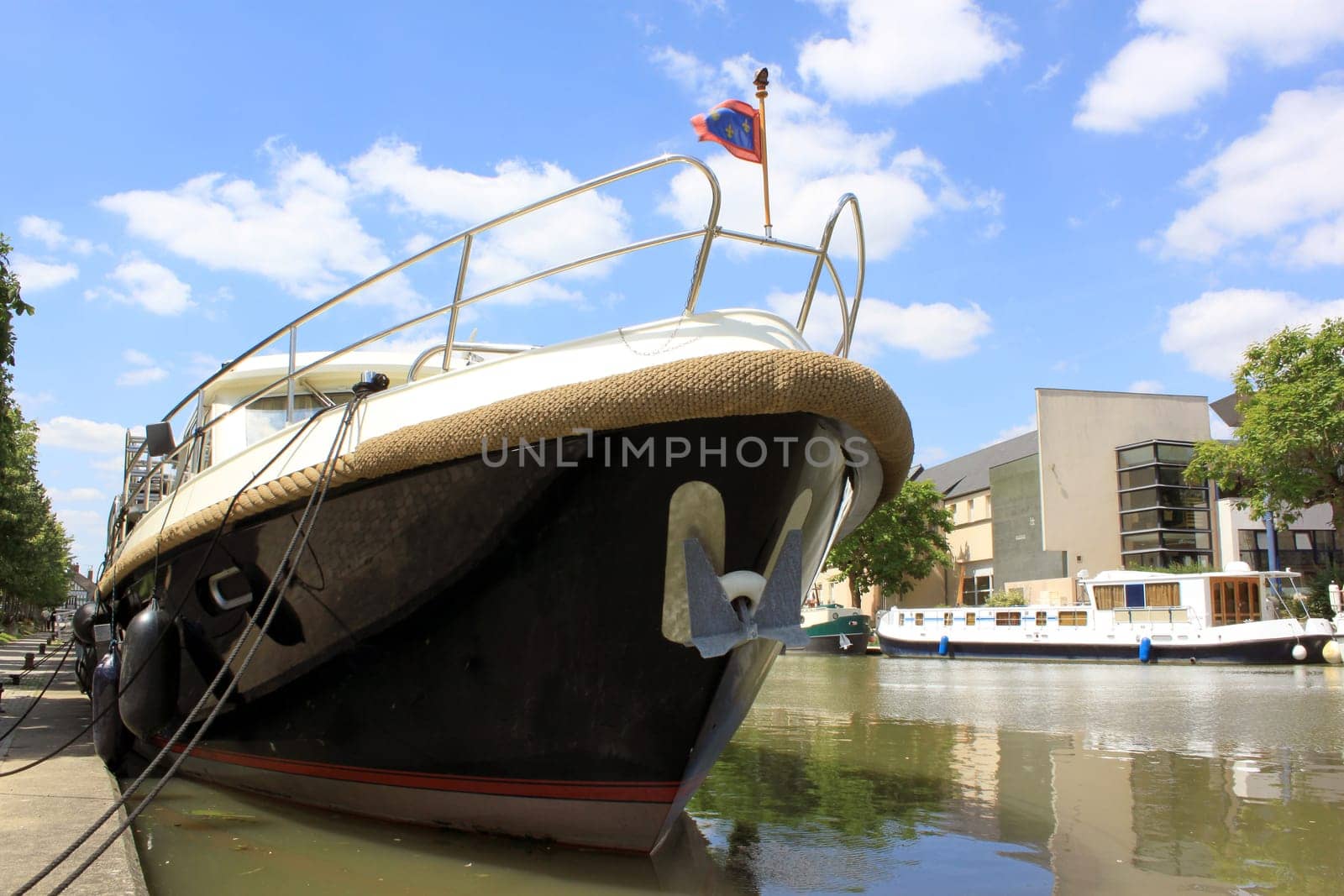 photo of the bow of a pleasure boat in a port