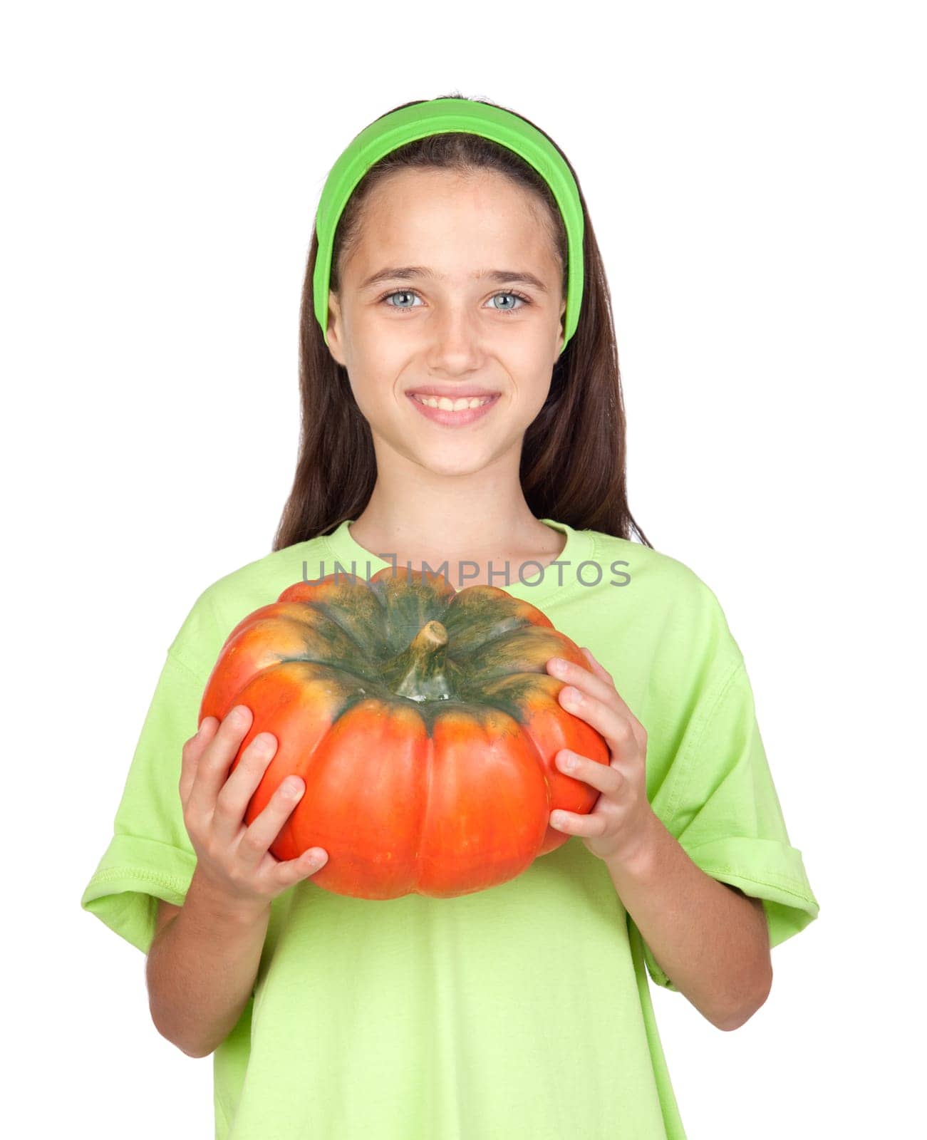 Happy girl in Halloween with a big pumpkin isolated on white background