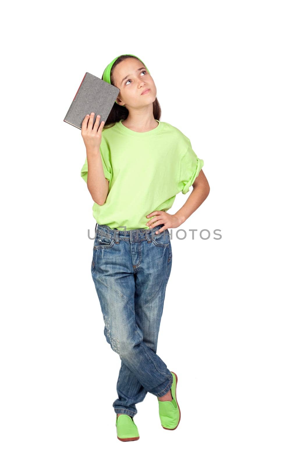 Adorable little girl reading a book isolated on white background