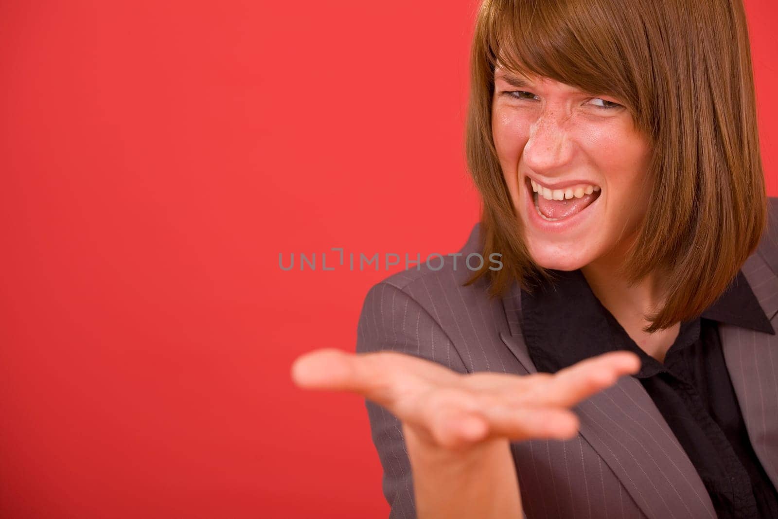 upset business woman over red background