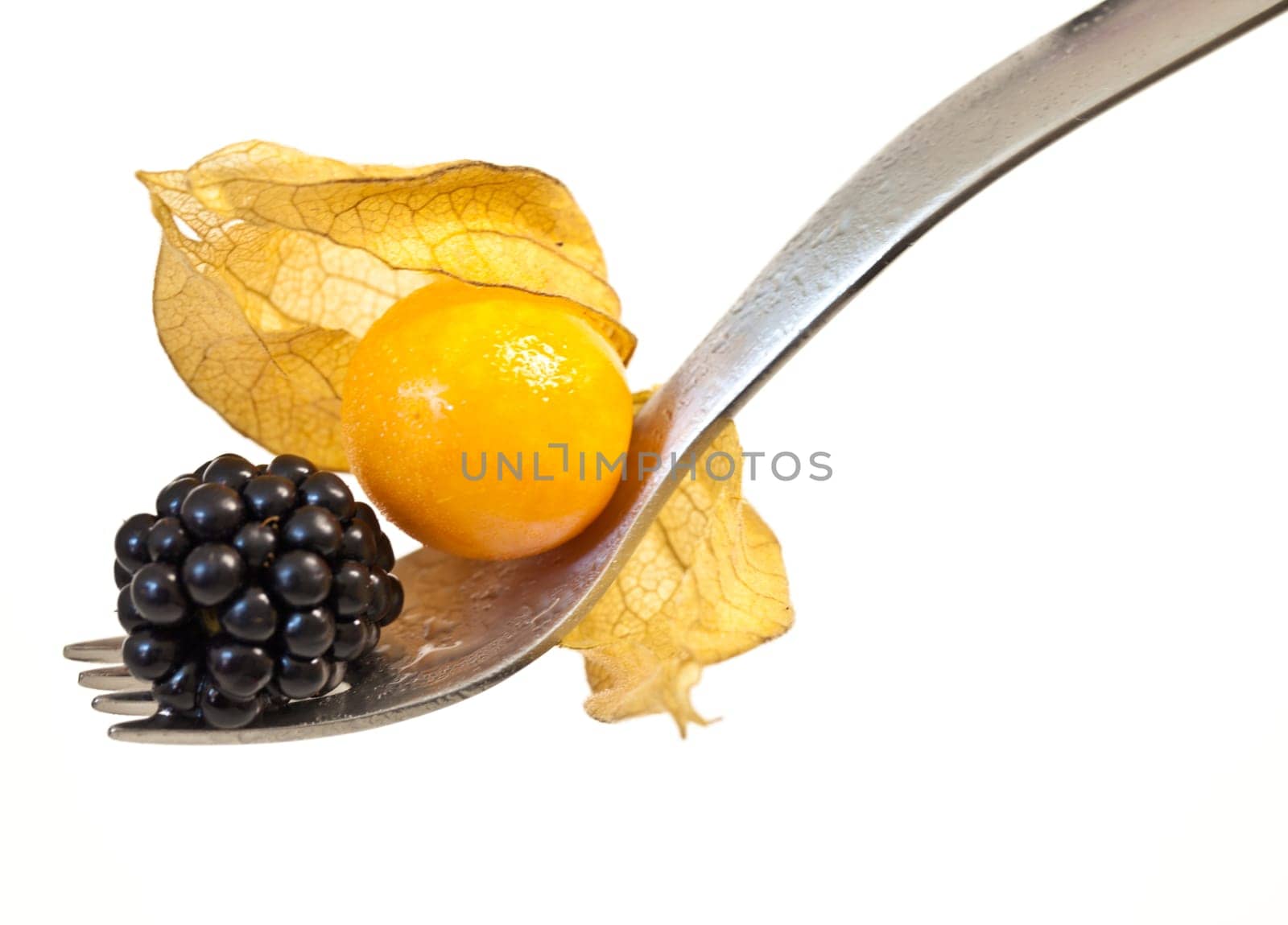 Fork bites with physalis and blackberry