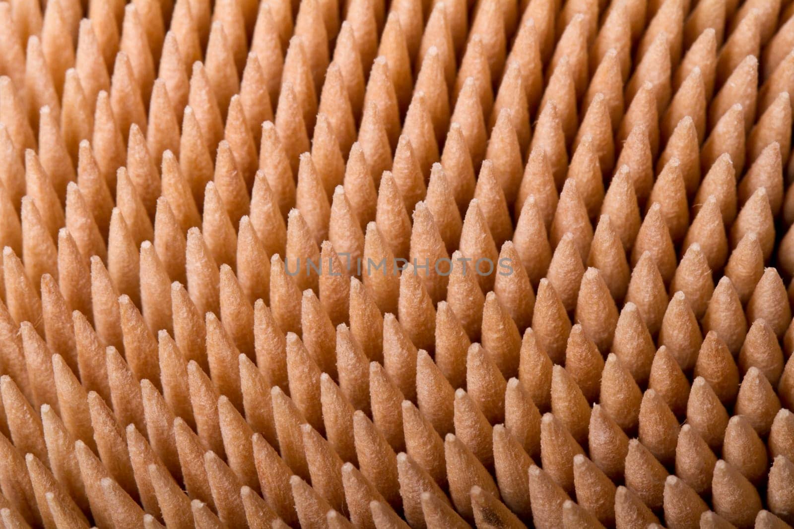 Macro view of a bunch of toothpicks inside a container.