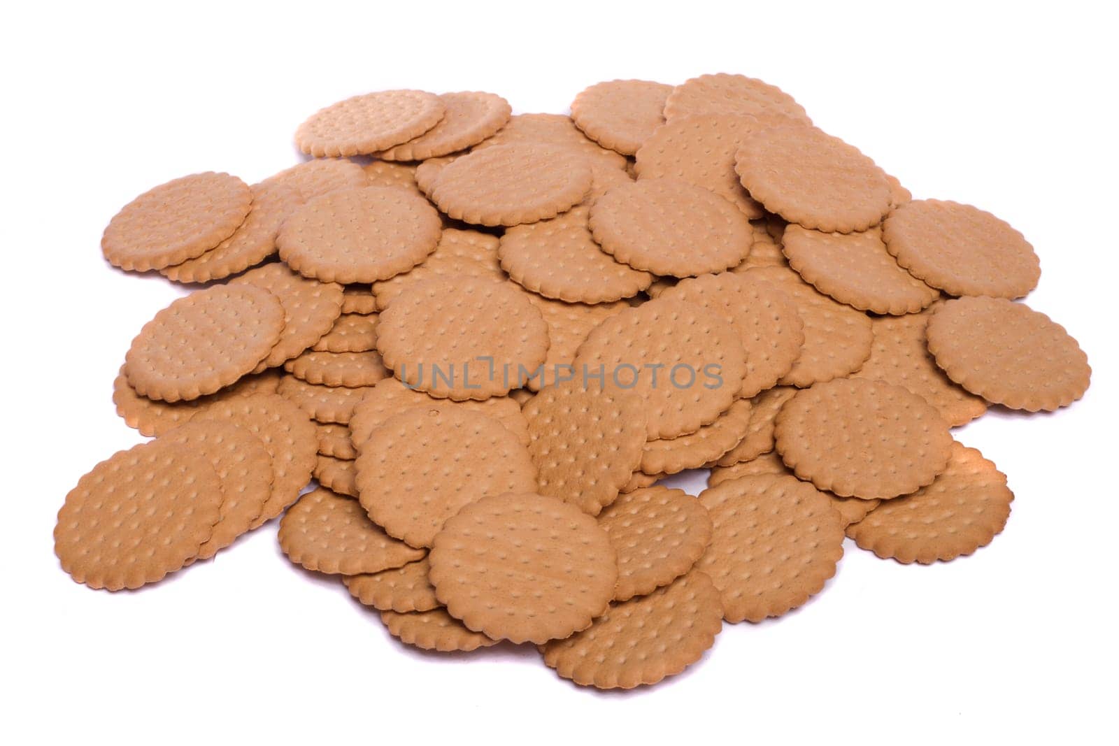 View of many round biscuits isolated on a white background.