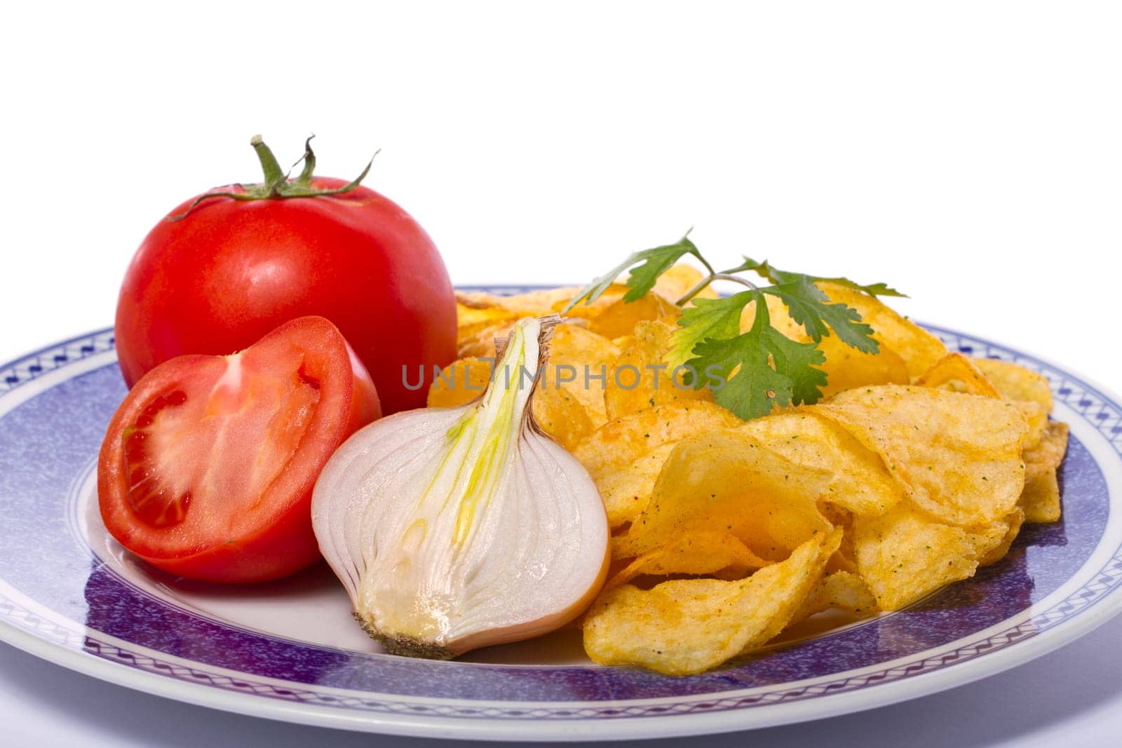 Close view of a single potato chip isolated on a white background.