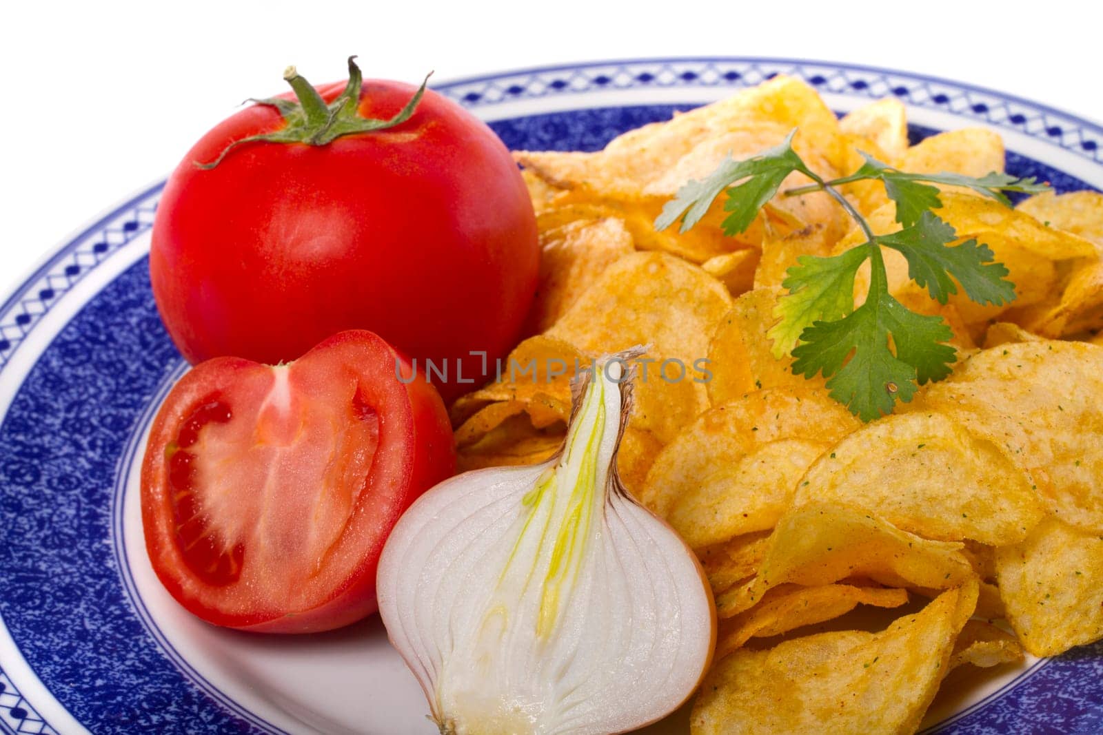 Close view of a single potato chip isolated on a white background.