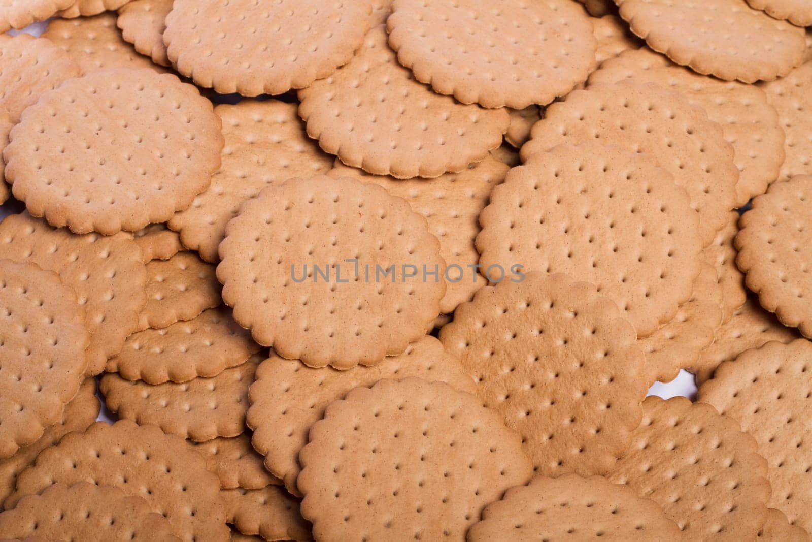 View of many round biscuits stacked on top of each other.