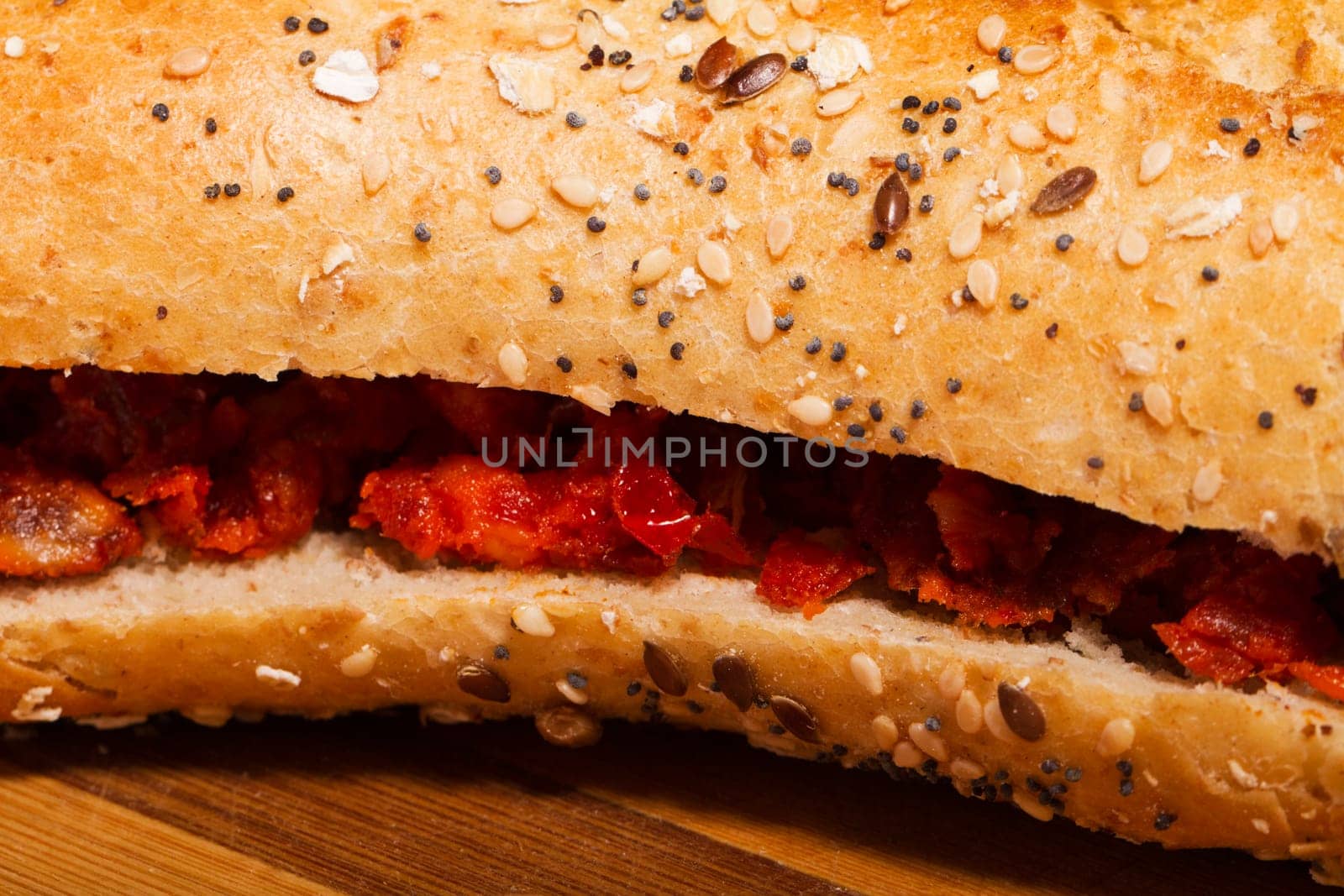 View of a dish of fresh sandwich with seeds filled with Portuguese chorizo.