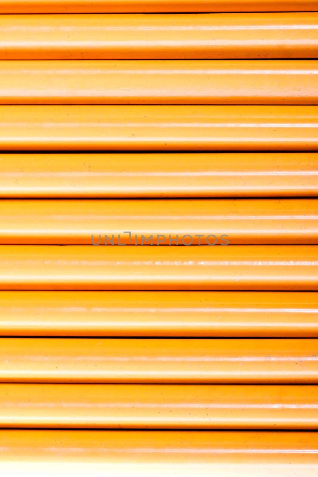 Close up view of a bunch of yellow pencils isolated on a white background.