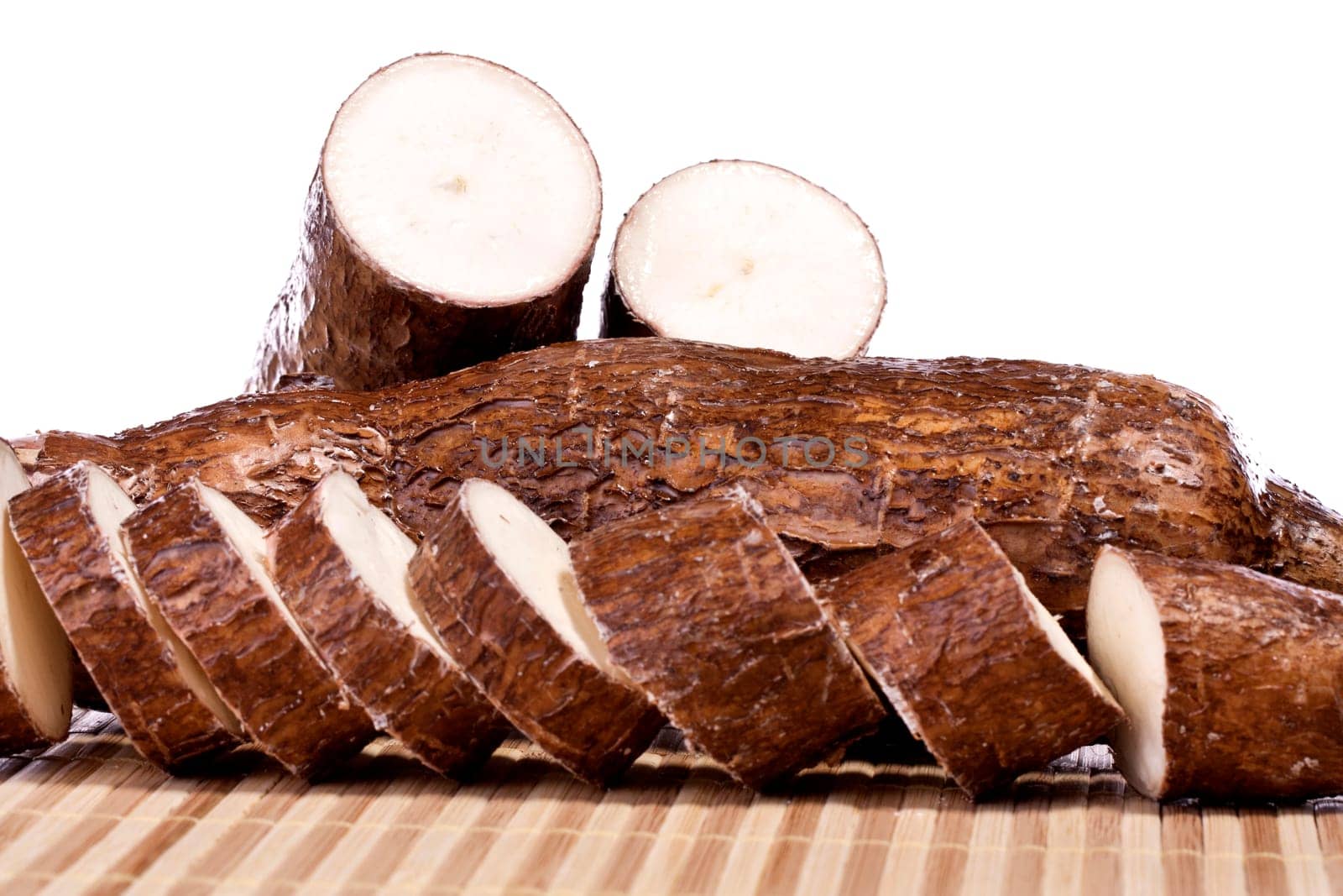 Close up view of the cassava root isolated on a white background.
