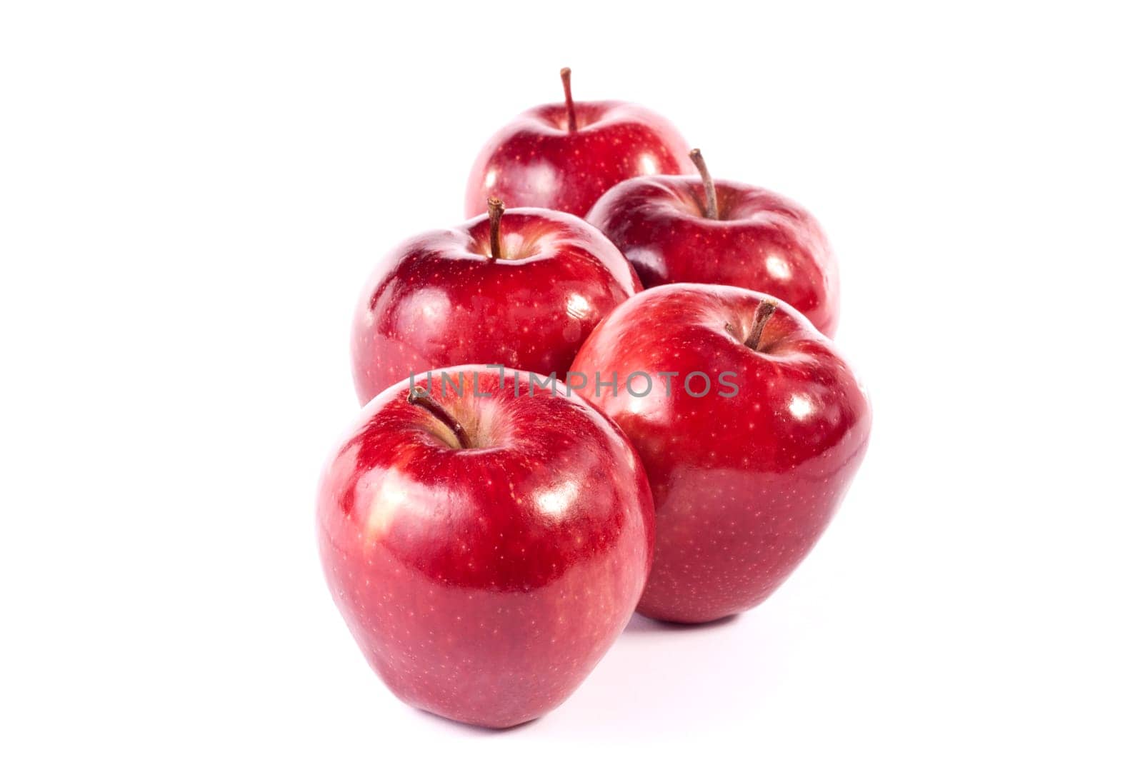 Close up view of some red apples isolated on a white background.