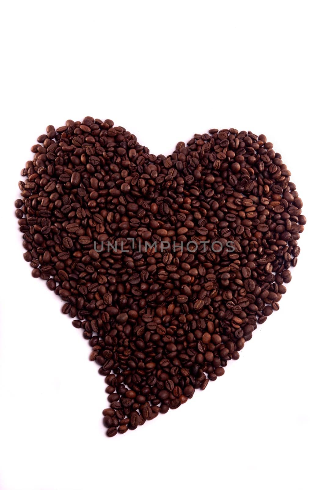 Close up view of a bunch of roasted beans of coffee.