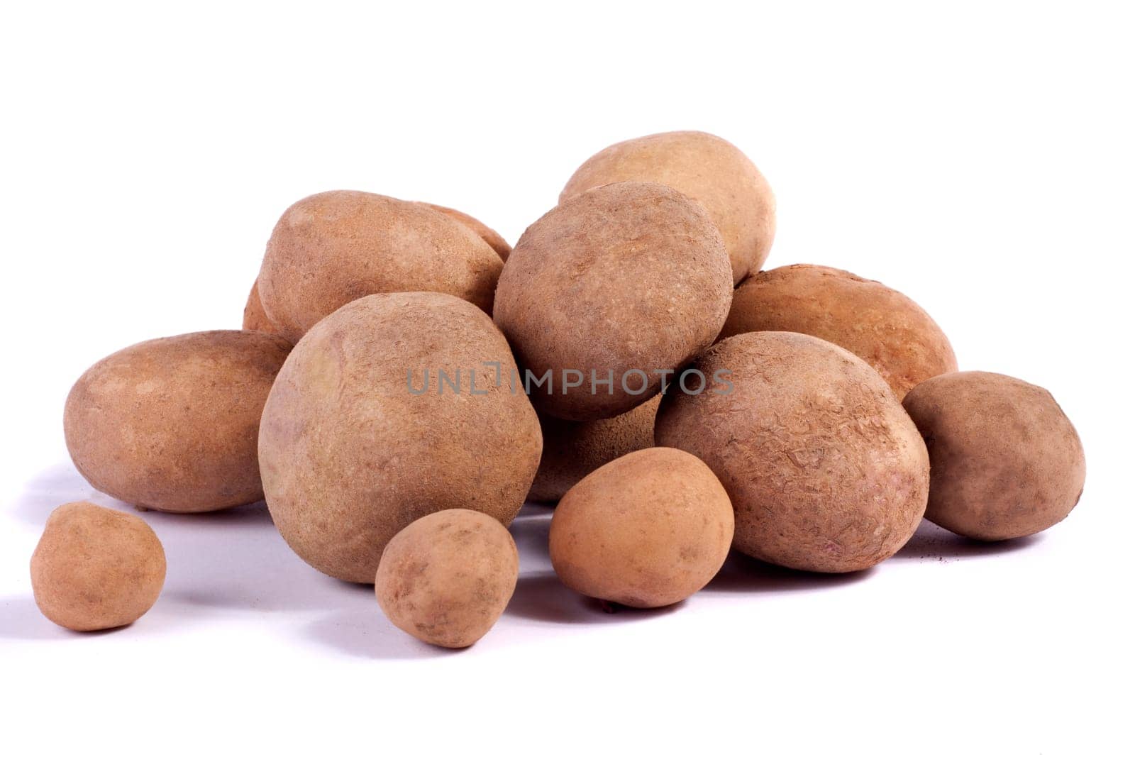 Close up view of some potatoes isolated on a white background.