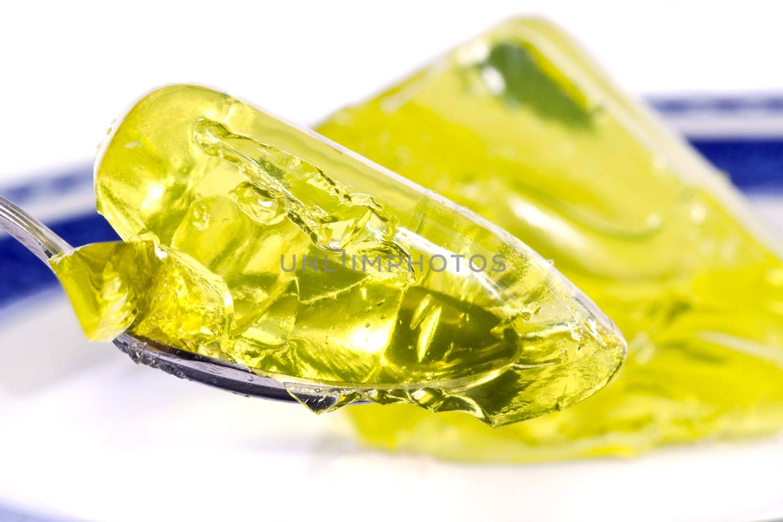 Close up view of several colorful gelatins isolated on a white background.